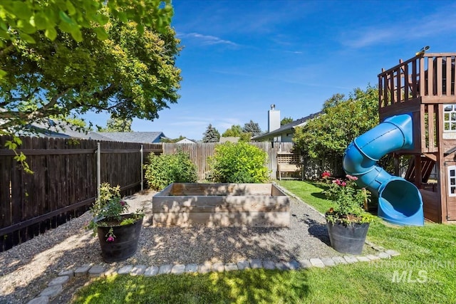 1722 W Mcglinchey St, Meridian, ID 83646 - fenced backyard with a playground and a vegetable garden