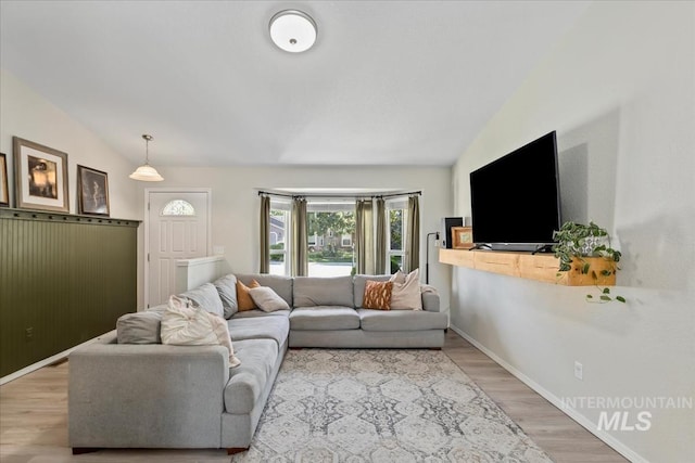 1722 W Mcglinchey St, Meridian, ID 83646 - living area featuring lofted ceiling and light wood-style floors