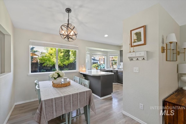 1722 W Mcglinchey St, Meridian, ID 83646 - dining room with a chandelier, healthy amount of natural light, light wood-type flooring, and recessed lighting
