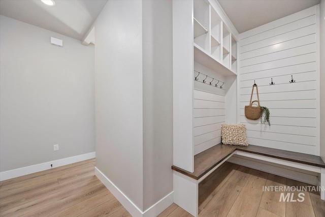 mudroom featuring light wood-type flooring and baseboards