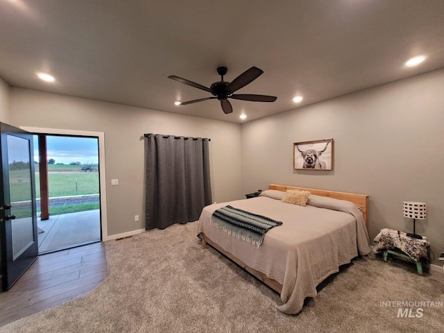 bedroom featuring wood-type flooring, access to exterior, and ceiling fan