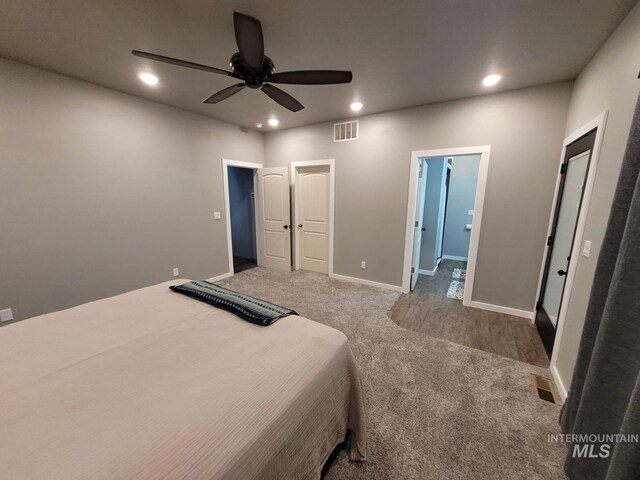 carpeted bedroom featuring ceiling fan