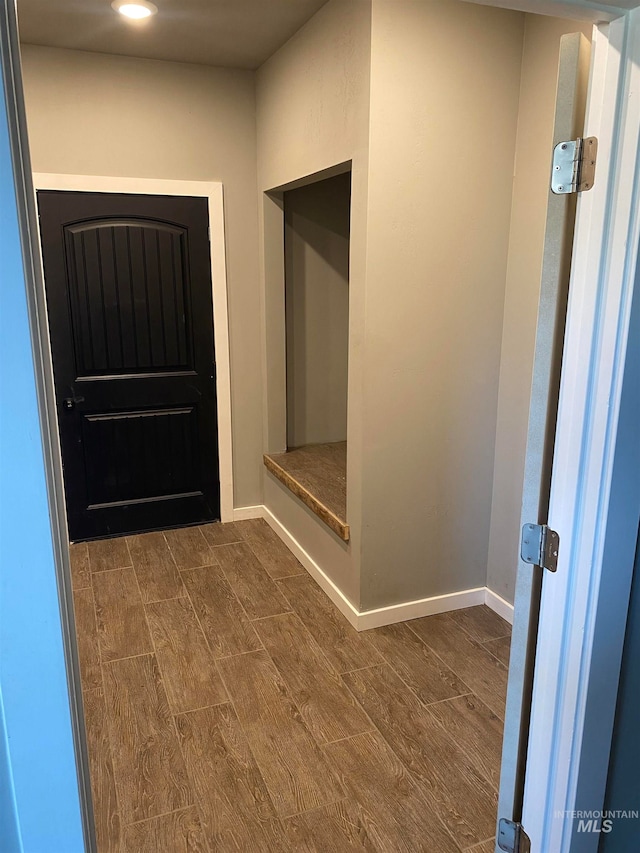 foyer with dark hardwood / wood-style floors