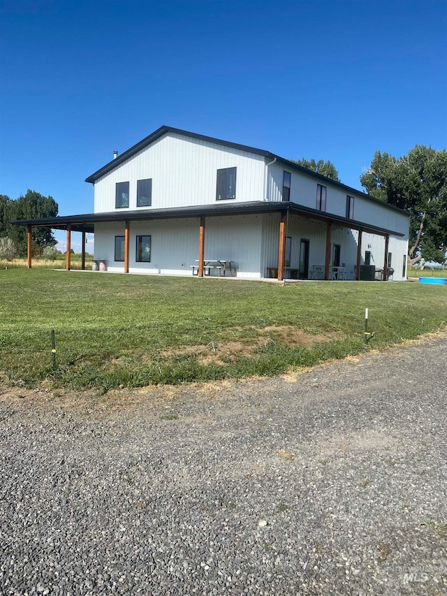 view of home's exterior with a lawn