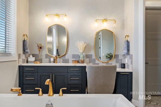 bathroom with vanity and backsplash