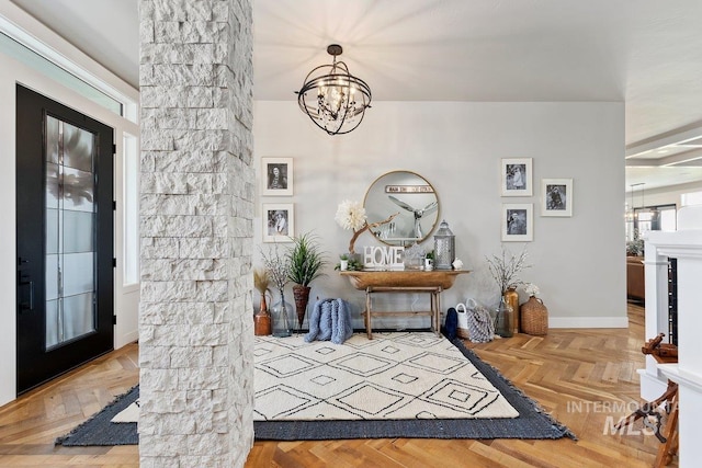 entrance foyer featuring parquet floors and a notable chandelier