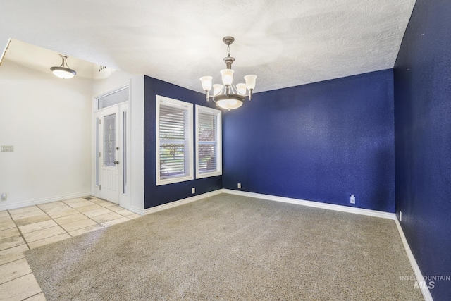 70 Pelican Dr, Rupert, ID 83350 - carpeted empty room with a chandelier, tile patterned flooring, and baseboards