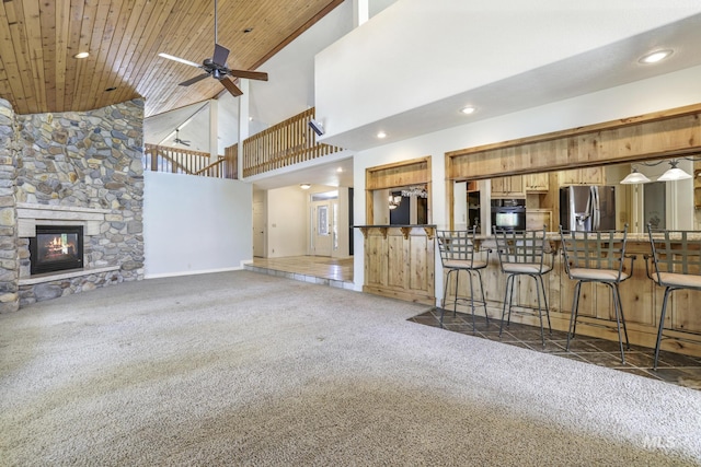 70 Pelican Dr, Rupert, ID 83350 - unfurnished living room featuring carpet floors, high vaulted ceiling, recessed lighting, wooden ceiling, and ceiling fan