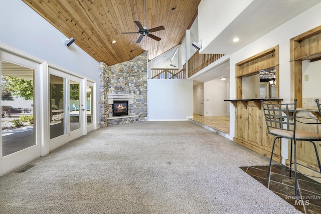 70 Pelican Dr, Rupert, ID 83350 - unfurnished living room featuring carpet, a ceiling fan, high vaulted ceiling, wooden ceiling, and a fireplace
