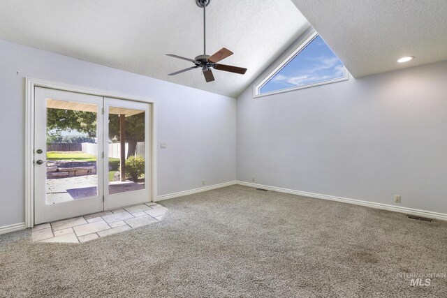 70 Pelican Dr, Rupert, ID 83350 - carpeted spare room with a ceiling fan, plenty of natural light, baseboards, lofted ceiling, and a textured ceiling
