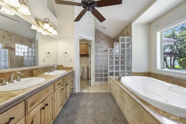 70 Pelican Dr, Rupert, ID 83350 - full bath featuring ceiling fan, a bath, toilet, double vanity, and lofted ceiling