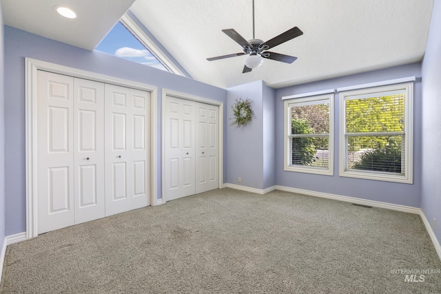 70 Pelican Dr, Rupert, ID 83350 - unfurnished bedroom featuring vaulted ceiling, multiple closets, carpet floors, baseboards, and ceiling fan