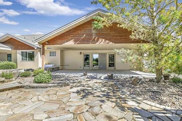 70 Pelican Dr, Rupert, ID 83350 - back of house featuring stucco siding and a patio