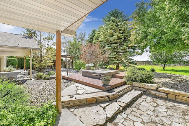 70 Pelican Dr, Rupert, ID 83350 - view of patio with a covered hot tub, a wooden deck, and a fenced backyard