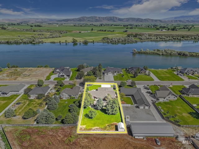 70 Pelican Dr, Rupert, ID 83350 - aerial view of residential area with a water and mountain view and property parcel outlined