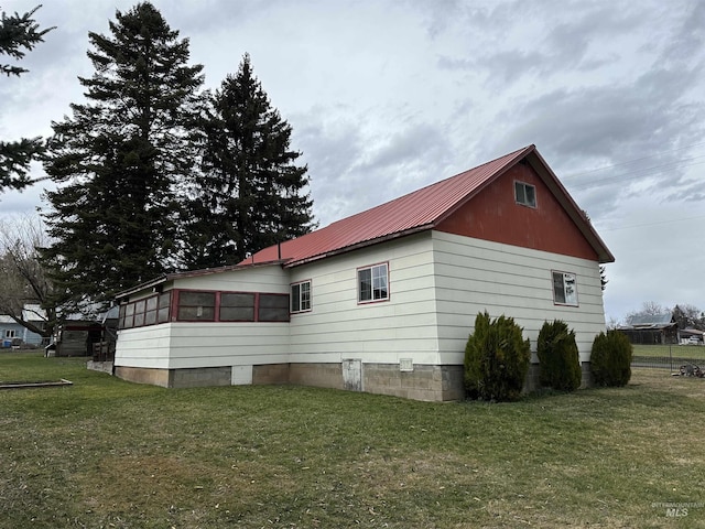 view of property exterior featuring a lawn