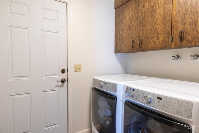 1205 Ponderosa Dr, Moscow, ID 83843 - laundry area featuring separate washer and dryer and cabinet space