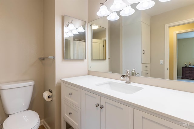 1205 Ponderosa Dr, Moscow, ID 83843 - full bath featuring vanity, toilet, and a chandelier