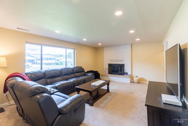 1205 Ponderosa Dr, Moscow, ID 83843 - living room featuring recessed lighting, a brick fireplace, light carpet, and baseboards