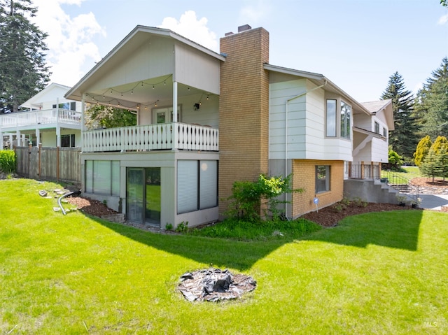 1205 Ponderosa Dr, Moscow, ID 83843 - back of property featuring a chimney, brick siding, and a balcony