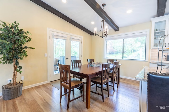 1205 Ponderosa Dr, Moscow, ID 83843 - dining space with light wood finished floors, baseboards, a chandelier, and french doors