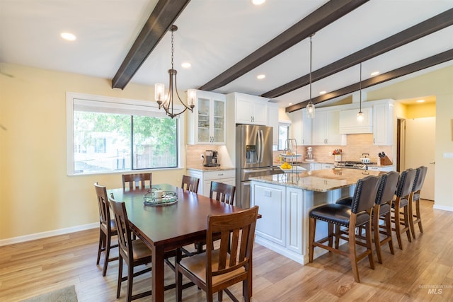 1205 Ponderosa Dr, Moscow, ID 83843 - dining space with plenty of natural light, recessed lighting, baseboards, light wood-type flooring, and beamed ceiling