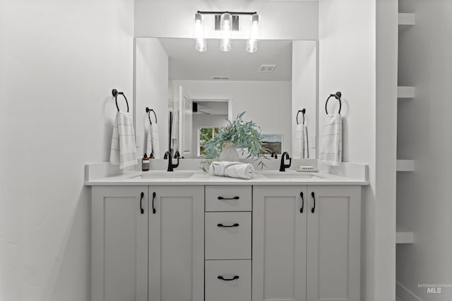 bathroom with ceiling fan and vanity