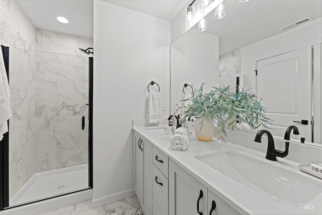 bathroom with vanity and walk in shower