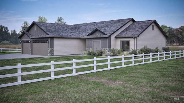 view of front facade with a garage and a front lawn