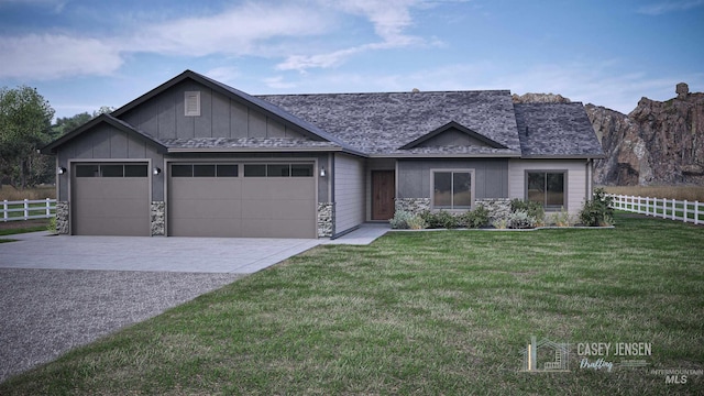 view of front of house with a garage and a front lawn