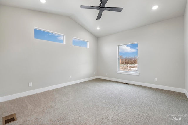 spare room featuring carpet flooring, ceiling fan, and lofted ceiling