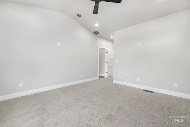 spare room with carpet flooring, ceiling fan, and lofted ceiling