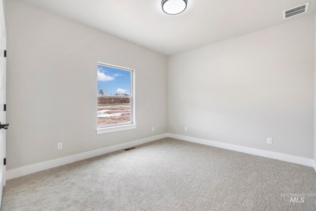 unfurnished room featuring carpet flooring