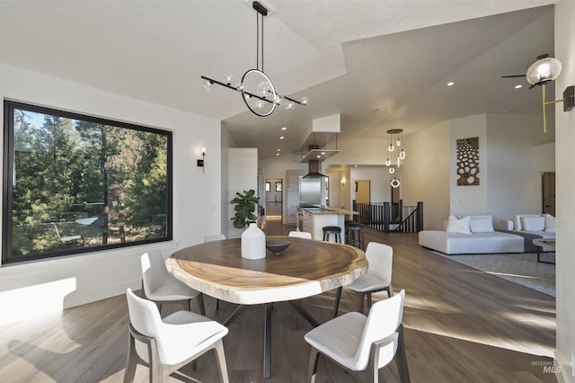 dining area featuring a chandelier and wood finished floors