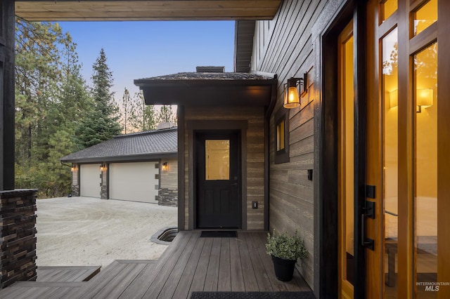 doorway to property featuring a garage