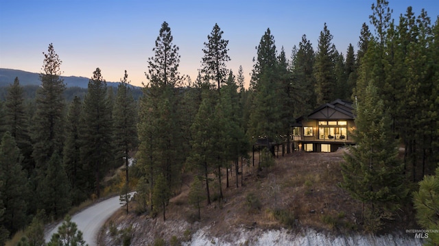 mountain view featuring a view of trees