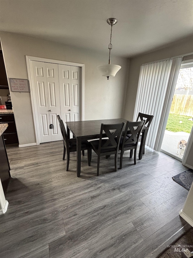 4618 Braeburn, Caldwell, ID 83607 - dining space with dark wood-style flooring and baseboards