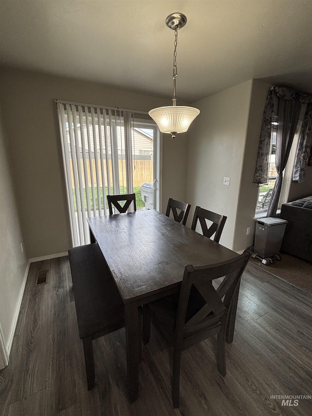 4618 Braeburn, Caldwell, ID 83607 - dining area with visible vents, baseboards, and wood finished floors