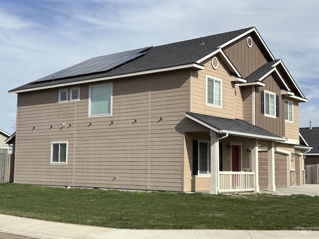 4618 Braeburn, Caldwell, ID 83607 - view of home's exterior with board and batten siding, a yard, solar panels, and concrete driveway