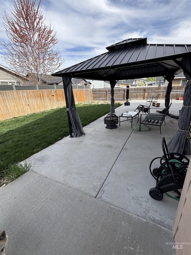 4618 Braeburn, Caldwell, ID 83607 - view of patio / terrace featuring a fenced backyard, a gazebo, and a fire pit