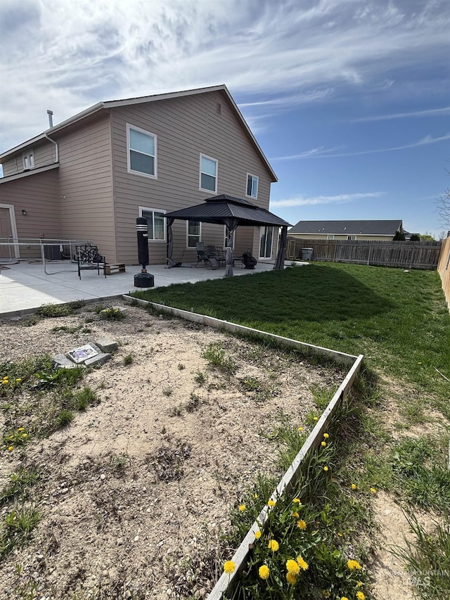 4618 Braeburn, Caldwell, ID 83607 - back of property featuring a patio area, a fenced backyard, and a lawn