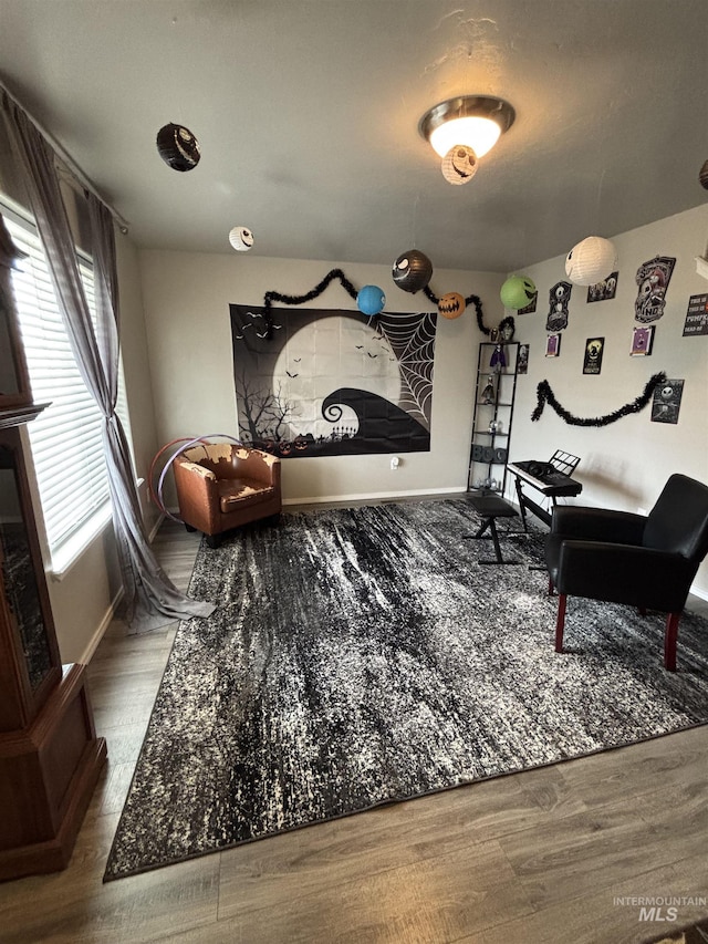 4618 Braeburn, Caldwell, ID 83607 - living area with baseboards and wood finished floors