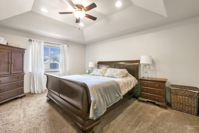 bedroom featuring a ceiling fan, a raised ceiling, recessed lighting, and carpet