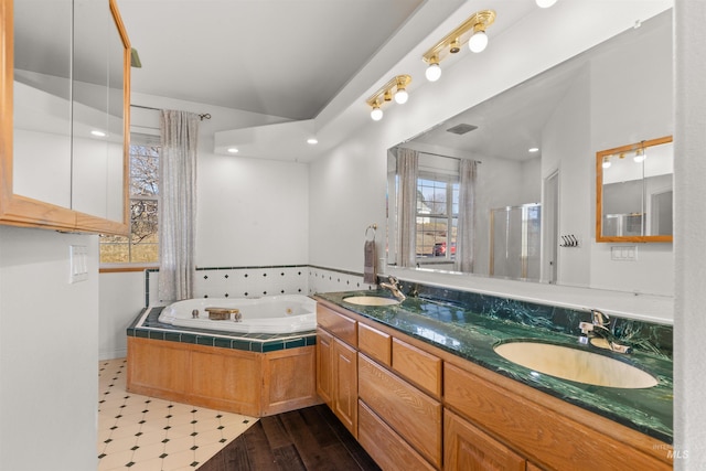 bathroom with vanity and a bathtub