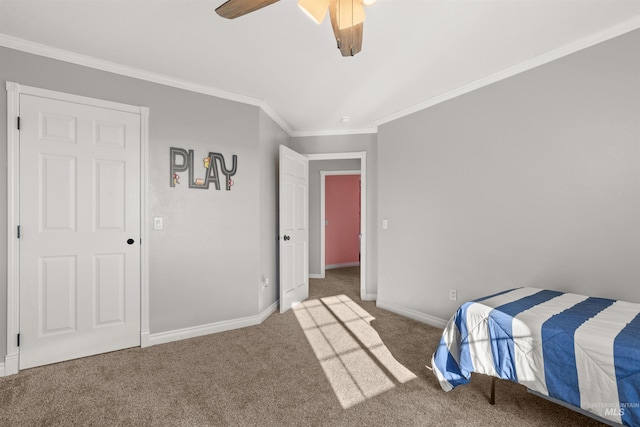 carpeted bedroom featuring ceiling fan and ornamental molding