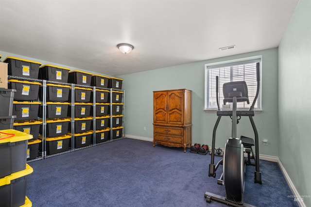 workout area featuring dark colored carpet