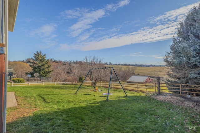 view of yard featuring a playground and a rural view