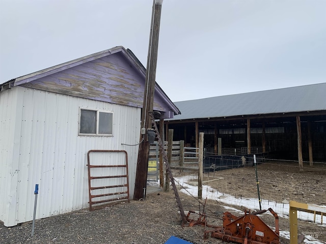 view of home's exterior with an outdoor structure