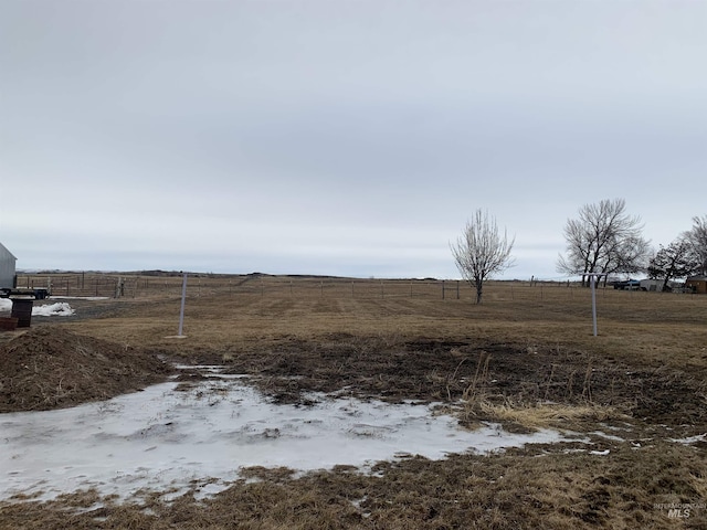 view of yard with a rural view