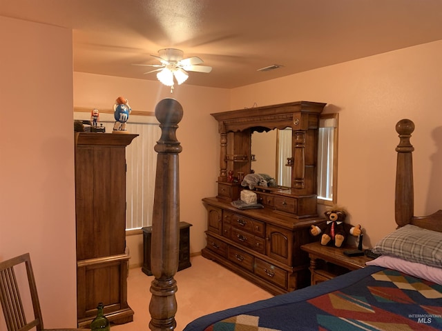 bedroom with light colored carpet and ceiling fan